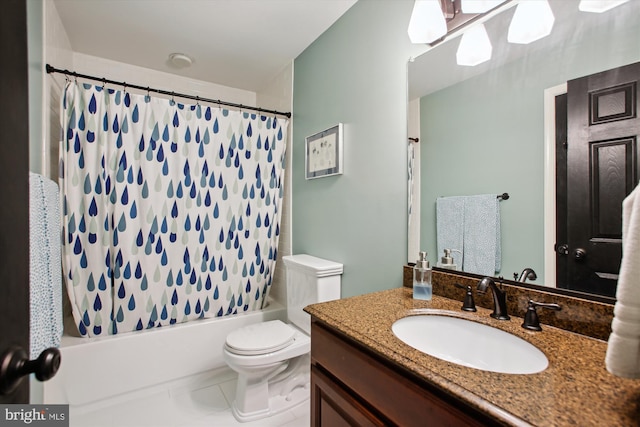 bathroom with toilet, vanity, shower / bath combo with shower curtain, and tile patterned flooring