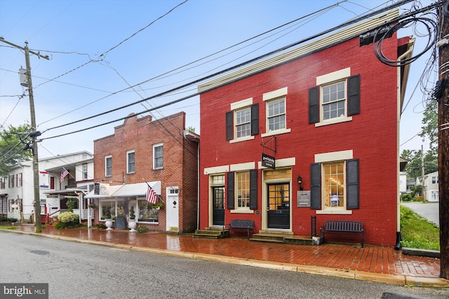 view of front of home with brick siding and entry steps