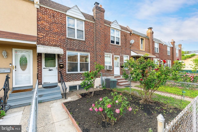 3788 Richmond St, Philadelphia, PA 19137 - townhome / multi-family property featuring brick siding, a chimney, a shingled roof, and a residential view
