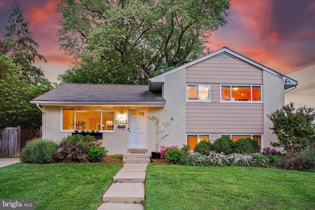 tri-level home with brick siding
