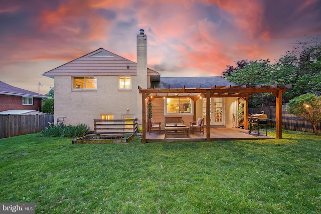 back of property at dusk featuring a chimney, a pergola, brick siding, an outdoor living space, and a patio area