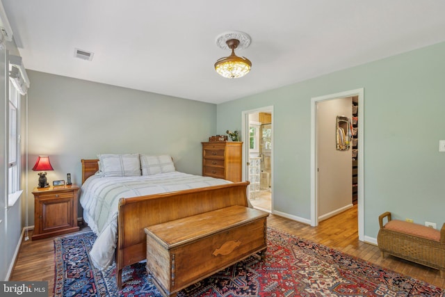 6813 Jeremiah Ct, Fairfax Station, VA 22039 - bedroom with wood finished floors, baseboards, and connected bathroom