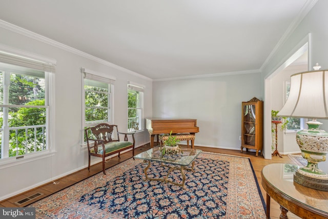 6813 Jeremiah Ct, Fairfax Station, VA 22039 - sitting room with crown molding, healthy amount of natural light, wood finished floors, and baseboards