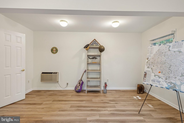 6813 Jeremiah Ct, Fairfax Station, VA 22039 - playroom with light wood finished floors, a wall mounted AC, and baseboards