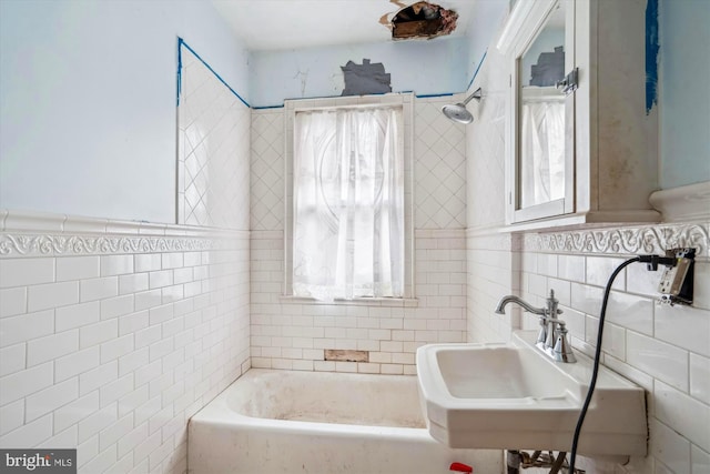 3101 Perry St, Mount Rainier, MD 20712 - full bath with tile walls, a bathtub, a sink, a wainscoted wall, and a shower