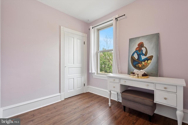 sitting room with wood finished floors and baseboards