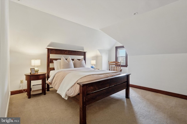 bedroom with light colored carpet, baseboards, and lofted ceiling