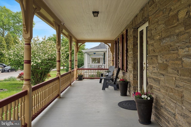 wooden terrace with covered porch