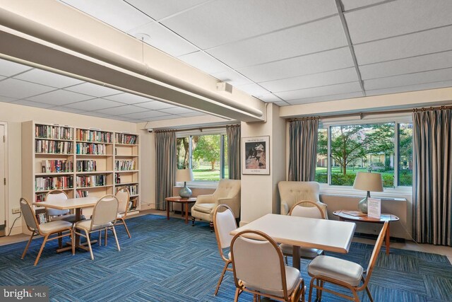 4201 Cathedral Ave NW Unit 415E, Washington, DC 20016 - dining room featuring carpet and a paneled ceiling