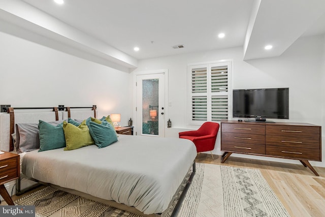 1440 Oak St NW Unit 1, Washington, DC 20010 - bedroom with light wood-type flooring, recessed lighting, and access to outside