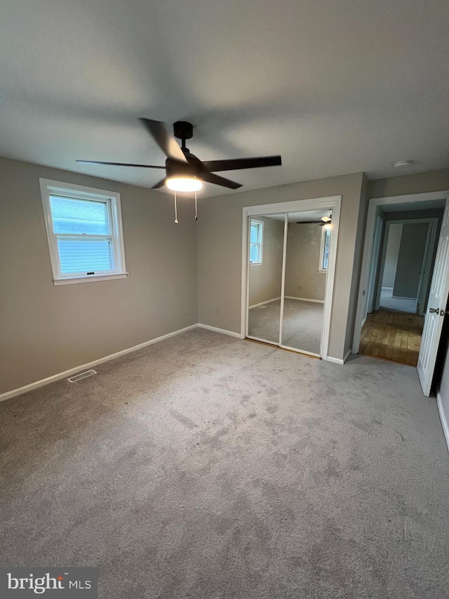 41 N Clinton Ave, Maple Shade, NJ 08052 - unfurnished bedroom with multiple windows, carpet, a closet, and ceiling fan
