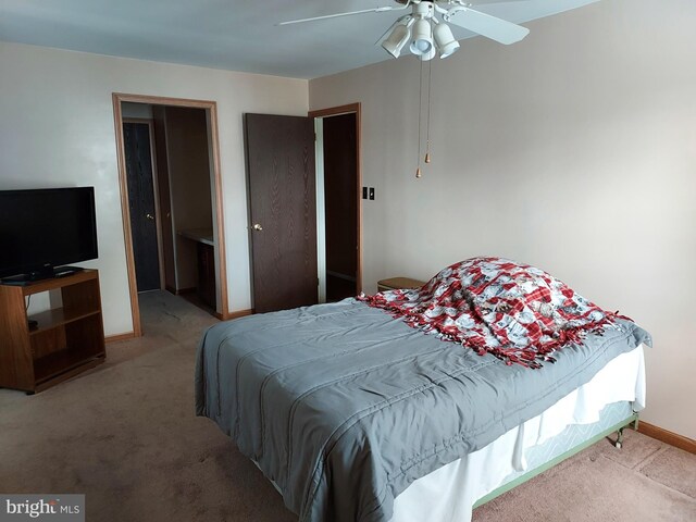 bedroom featuring carpet flooring, baseboards, and ceiling fan