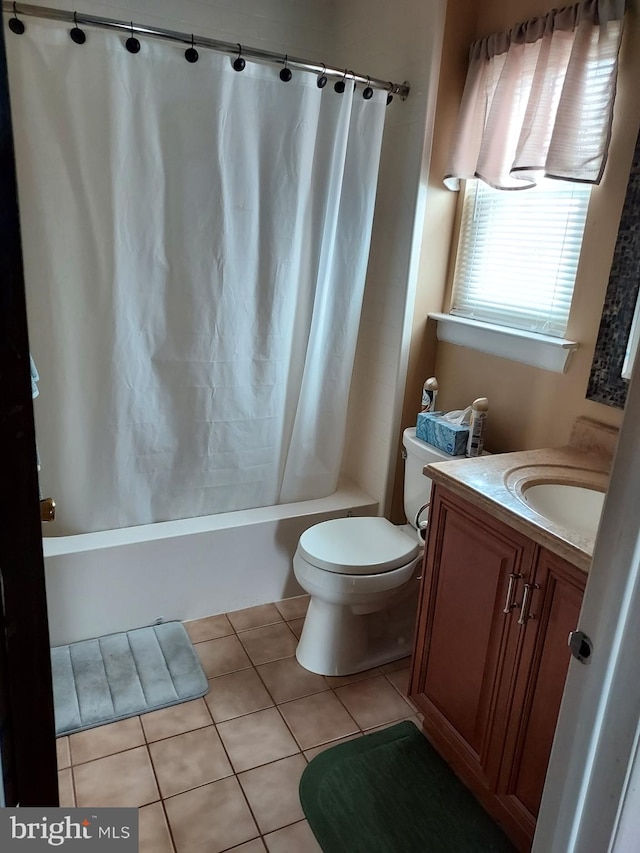 full bathroom with tile patterned floors, shower / bath combo, toilet, and vanity