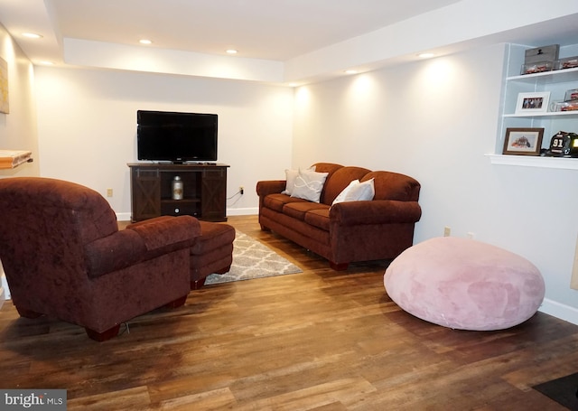 living area featuring wood finished floors, recessed lighting, and baseboards