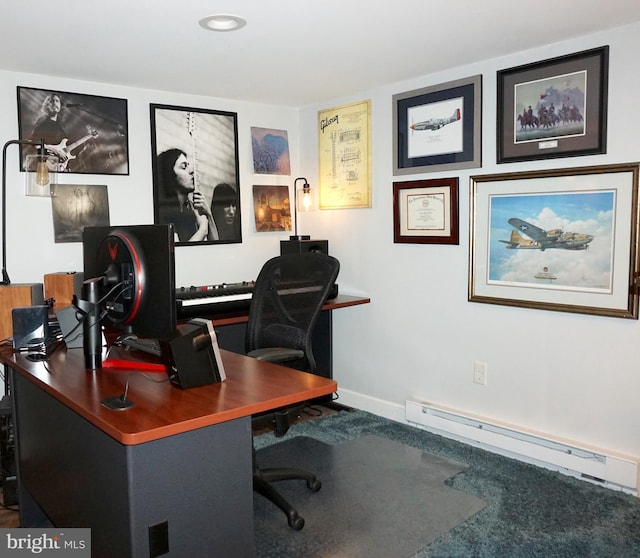 office area with a baseboard heating unit and baseboards