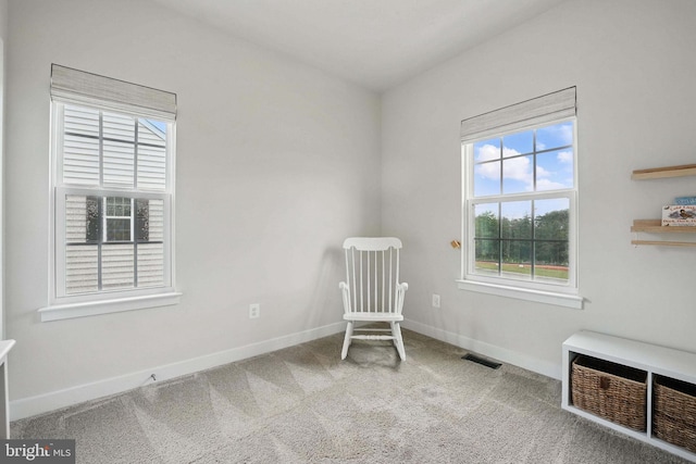 unfurnished room featuring carpet flooring and baseboards