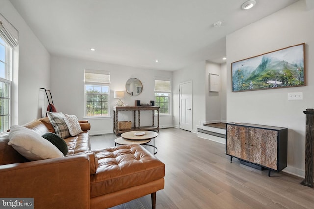 living area featuring wood finished floors, recessed lighting, and baseboards