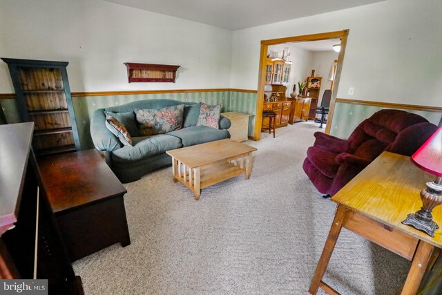 4361 Sutton Cir, Reading, PA 19606 - carpeted living area featuring wainscoting and a chandelier