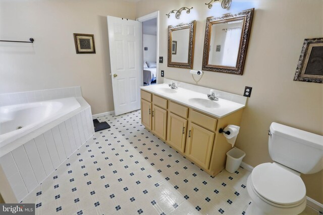 4361 Sutton Cir, Reading, PA 19606 - bathroom featuring toilet, baseboards, a bath, and double vanity