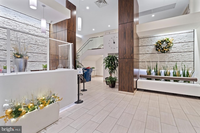 building lobby with stairs and recessed lighting
