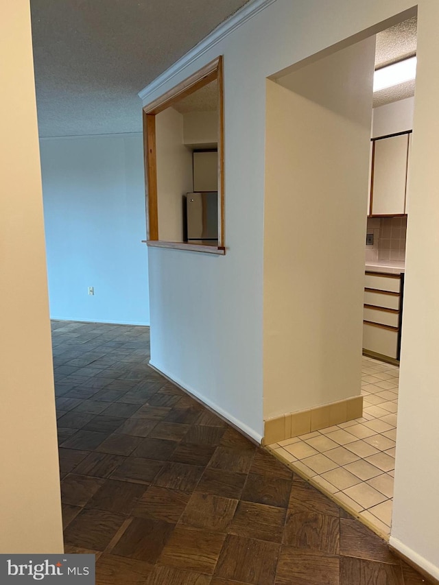 corridor featuring baseboards