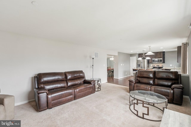 199 Colbert St, Taneytown, MD 21787 - carpeted living room with baseboards, recessed lighting, and a sink