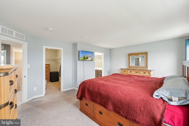199 Colbert St, Taneytown, MD 21787 - bedroom featuring light carpet, a spacious closet, baseboards, a closet, and ensuite bathroom