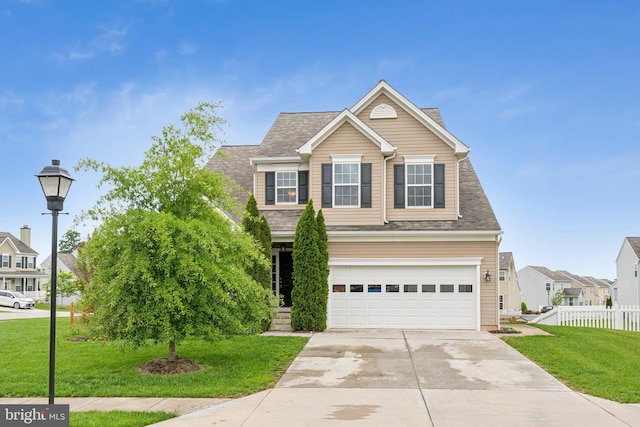 199 Colbert St, Taneytown, MD 21787 - traditional-style home featuring concrete driveway, an attached garage, a residential view, and roof with shingles