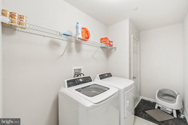 199 Colbert St, Taneytown, MD 21787 - washroom with washer and clothes dryer and baseboards