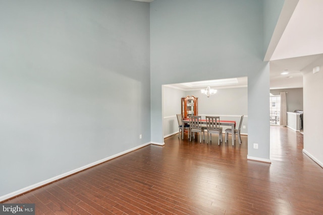 199 Colbert St, Taneytown, MD 21787 - dining room with a chandelier, a high ceiling, wood finished floors, baseboards, and ornamental molding