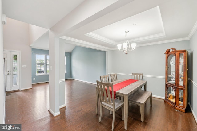 199 Colbert St, Taneytown, MD 21787 - dining space with dark wood-style flooring, a chandelier, a tray ceiling, ornamental molding, and baseboards