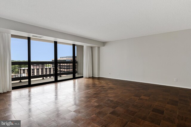 3800 Fairfax Dr Unit 1011, Arlington, VA 22203 - unfurnished room with baseboards and a textured ceiling