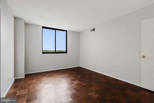 3800 Fairfax Dr Unit 1011, Arlington, VA 22203 - empty room with baseboards and a textured ceiling