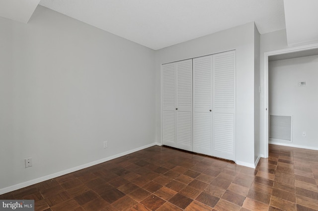 3800 Fairfax Dr Unit 1011, Arlington, VA 22203 - unfurnished bedroom featuring a closet and baseboards