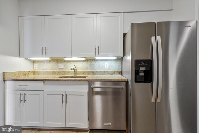 3800 Fairfax Dr Unit 1011, Arlington, VA 22203 - kitchen with appliances with stainless steel finishes, a sink, and white cabinets