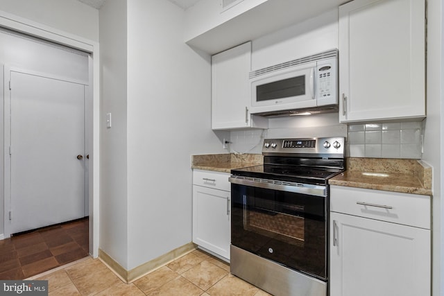 3800 Fairfax Dr Unit 1011, Arlington, VA 22203 - kitchen featuring stainless steel range with electric cooktop, white microwave, decorative backsplash, white cabinets, and light stone counters