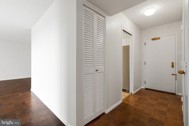 3800 Fairfax Dr Unit 1011, Arlington, VA 22203 - hall featuring baseboards and a textured ceiling