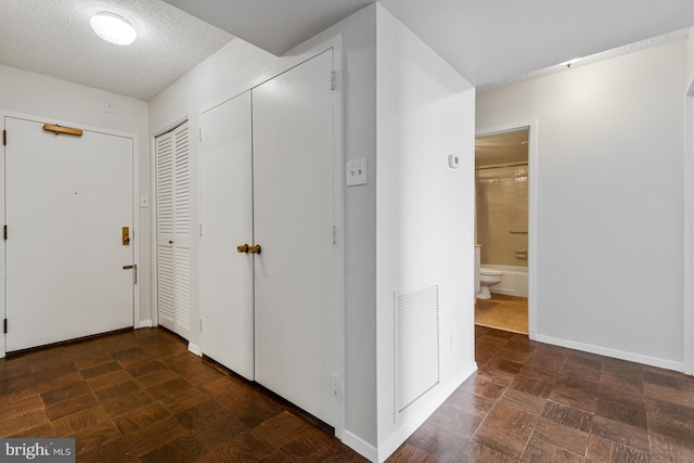 3800 Fairfax Dr Unit 1011, Arlington, VA 22203 - hall with baseboards and a textured ceiling