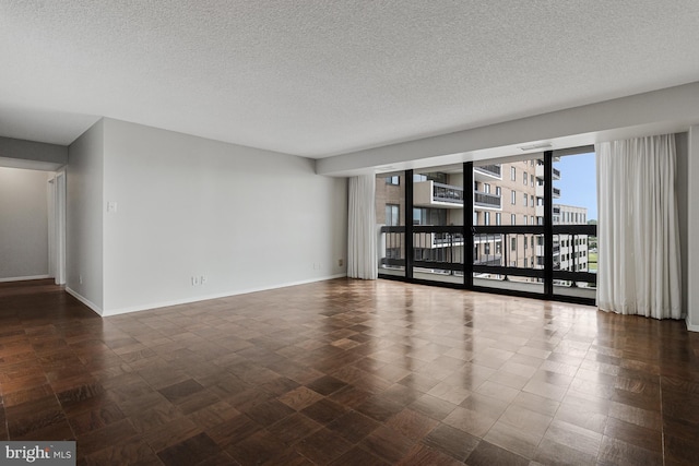 3800 Fairfax Dr Unit 1011, Arlington, VA 22203 - empty room featuring a textured ceiling and baseboards