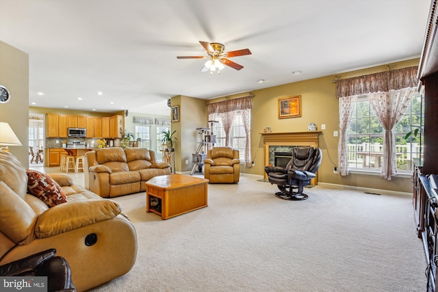7229 Antares Dr, Gaithersburg, MD 20879 - living area with a ceiling fan, healthy amount of natural light, recessed lighting, and light colored carpet