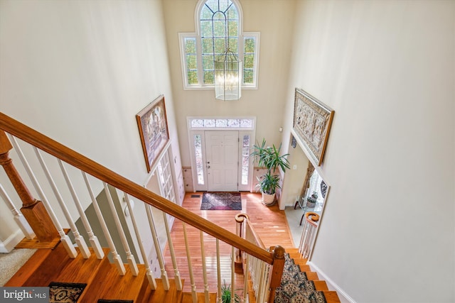 7229 Antares Dr, Gaithersburg, MD 20879 - entrance foyer featuring a high ceiling, stairs, wood finished floors, baseboards, and a chandelier