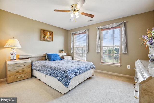 7229 Antares Dr, Gaithersburg, MD 20879 - bedroom with light colored carpet, baseboards, and ceiling fan