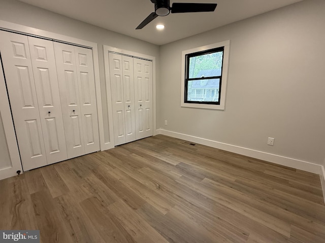 5 Kent Ave, Ocean View, DE 19970 - unfurnished bedroom with multiple closets, baseboards, wood finished floors, ceiling fan, and recessed lighting
