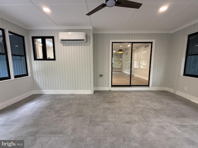 5 Kent Ave, Ocean View, DE 19970 - spare room featuring a wall unit AC, a ceiling fan, ornamental molding, and baseboards