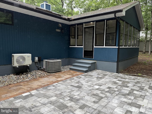 5 Kent Ave, Ocean View, DE 19970 - view of patio featuring central AC unit, a sunroom, entry steps, and ac unit