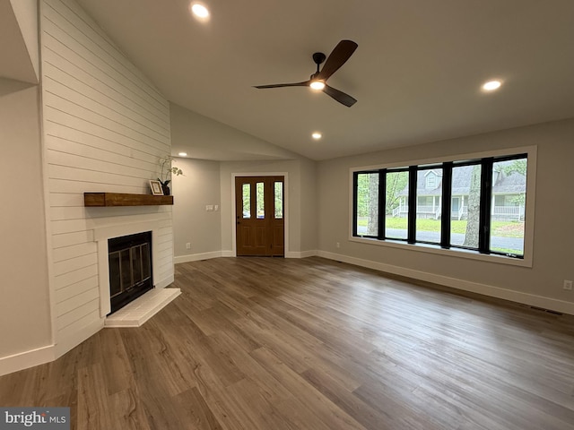 5 Kent Ave, Ocean View, DE 19970 - unfurnished living room featuring a ceiling fan, vaulted ceiling, a large fireplace, recessed lighting, and wood finished floors