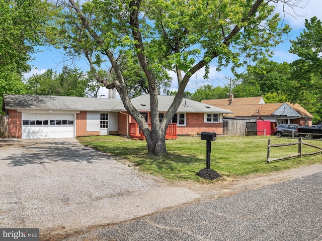 108 Kingsway Dr, Riviera Beach, MD 21122 - ranch-style house featuring brick siding, asphalt driveway, and an attached garage