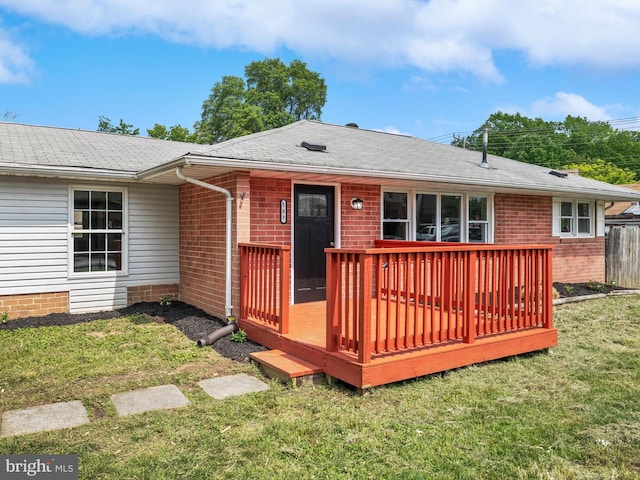 108 Kingsway Dr, Riviera Beach, MD 21122 - rear view of property with brick siding, a yard, a deck, and roof with shingles