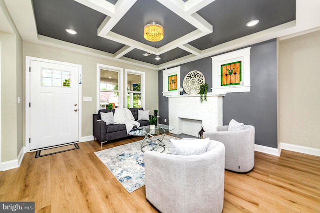 living room with baseboards, a brick fireplace, wood finished floors, and coffered ceiling