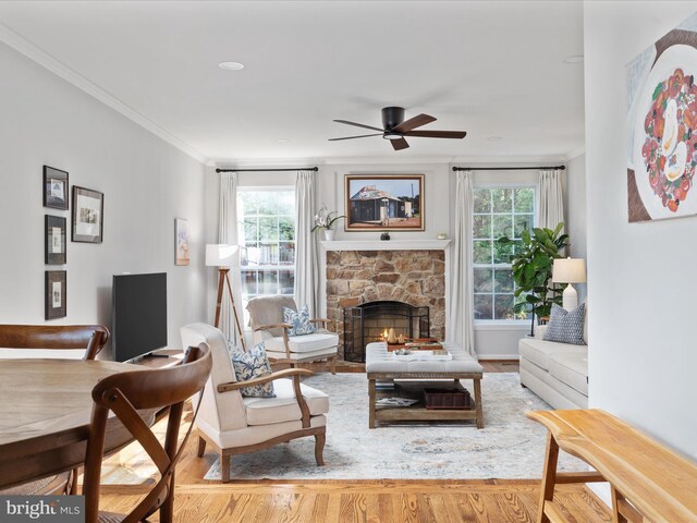 35513 Sourwood Pl, Round Hill, VA 20141 - living area featuring a ceiling fan, healthy amount of natural light, wood finished floors, a fireplace, and ornamental molding